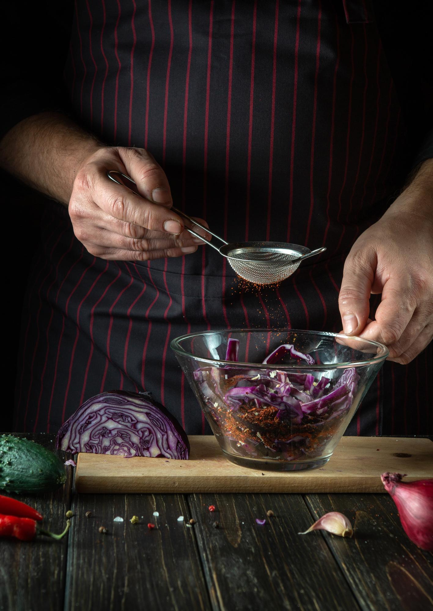 Chef preparing ingredients in workshop kitchen